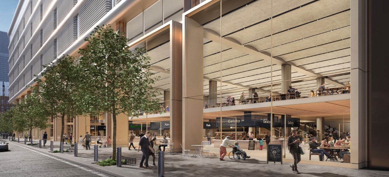 A modern urban plaza featuring a glass and wood building with various dining options and outdoor seating, surrounded by greenery and pedestrians.